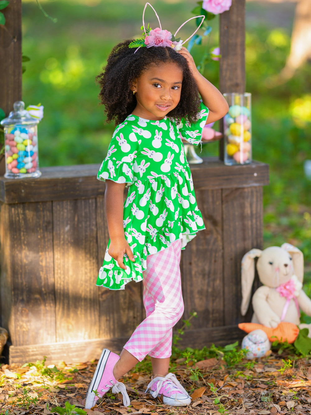 Girls Easter-themed set features ruffle sleeve hi-lo tunic and all-over floral or plaid print stretchy leggings for 2T to 10Y for toddlers and girls