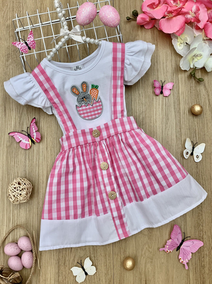 girls spring set features a white top with ruffle sleeves and bunny applique and a plaid skirt with suspenders and faux buttons and a white hem 2T to 10Y
